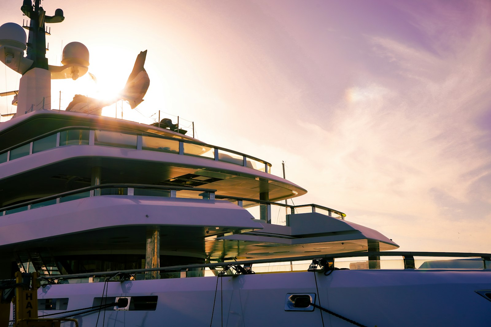 Electric motor yacht gliding across the water at sunset