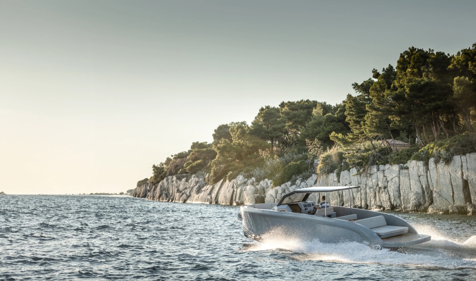 The RAND Escape electric motorboat on open water, seen in three-quarter profile